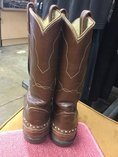 Size 6 Tony lama Boots On tip of boot and back of heel there is a brown snake skin like look very cool!! Genuine leather... fit up to 6.5 or 7. 3 inches wide at ball of foot... 9 and 1/4 wearable length Brown Leather Heeled Boots For Western-themed Events, Fitted Hand Tooled Boots With Round Toe, Western Brown Heeled Boots With Leather Lining, Brown Heeled Boots With Leather Lining And Snip Toe, Brown Snip Toe Boots With Leather Lining, Brown Leather Lined Snip Toe Boots, Western Brown Snip Toe Heeled Boots, Brown Boots With Reinforced Heel For Western-themed Events, Brown Round Toe Heeled Boots For Rodeo