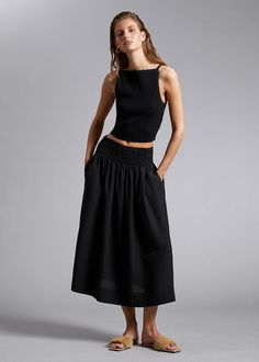 Smocked Waist Midi Skirt - Black - Midi skirts - & Other Stories US Chic Midi Bottoms With Gathered Waist, Casual Midi Length Skirt With Gathered Waist, Casual Midi Skirt With Gathered Waist, Casual Midi-length Bottoms With Gathered Waist, Casual Bottoms With Gathered Waist, Midi Length, Casual Midi Bottoms With Gathered Waist, Summer Gathered Waist Midi Skirt, Casual Maxi Skirt With Gathered Waist And Relaxed Fit, Summer Midi Skirt With Gathered Waist