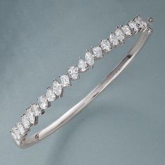 Indulge in luxury with this breathtaking 4 1/2 carat multi-shape diamond bangle bracelet. Crafted in 14K solid gold, this elegant piece features a stunning array of diamonds in various shapes, expertly set to reflect maximum brilliance. Perfect for special occasions or adding a touch of sophistication to your everyday look, this bracelet is a statement of timeless elegance and refined beauty.Designed for women who appreciate luxury, this diamond bangle combines classic craftsmanship and modern s Diamond Bangle Bracelet, Diamond Bangles Bracelet, Diamond Bangle, 2 Carat, Bezel Setting, Bangle Bracelet, Everyday Look, Lab Grown, Lab Grown Diamonds