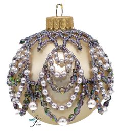 a christmas ornament with pearls and beads