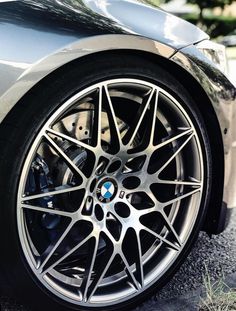 the front wheel of a silver sports car