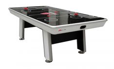 an air hockey table with two red balls on it