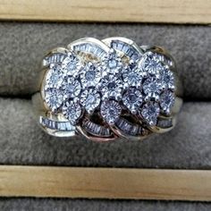 What A Statement Ring! Bling Bling! Approximately .50ctw Round & Baguette Diamonds Make Up This Ring. Set In 18k Over Sterling Silver. You Will Be Wowed At The Beauty This Has. It Is Just Amazing In Person. Absolutely No Diamonds Missing. It Is A Heavy Ring It's Very Well Made. I Am Not 100 Percent On Carat Weight That Is Approximate But It Has Lots Of Diamonds In This. No Paperwork. No Refunds. Used As Is Final Sale. Normal Wear And Scratches. Wedding Cluster Ring With Baguette Diamonds In Diamond White, Silver Cluster Diamond Ring With Baguette Diamonds, Diamond White Cluster Jewelry With Baguette Diamonds, Dazzling Diamond Cluster Ring With Baguette Diamonds, Dazzling Baguette Diamond Ring For Anniversary, Dazzling Cluster Baguette Diamond Rings, Dazzling Baguette Diamond Cluster Rings, Dazzling Cluster Rings With Baguette Diamonds, Round Cluster Ring With Baguette Diamonds