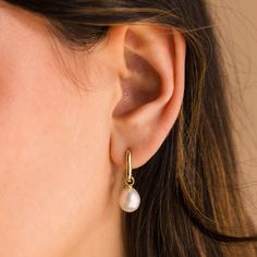 D A N G L I N G ∙ P E A R L ∙ H U G G I E S Radiate refined sophistication with our Dangling Freshwater Pearl Hoops, a symbol of purity and love. These pearl earrings add grace and classic charm to your everyday outfits. Adorn yourself in effortless elegance with every sway ✨ * Material: High Quality Solid 925 Sterling Silver  * Finish: Sterling Silver ∙ 18K Gold * Hoop Dimensions: ~6.5mm Inner Diameter | ~10.5mm Outer Diameter * Featuring Link Huggie Hoop Earrings with a dangling Freshwater Pea Delicate Drop Huggie Earrings For Wedding, Minimalist Hypoallergenic Huggie Earrings For Wedding, Minimalist Teardrop Huggie Earrings For Wedding, Delicate Small Hoop Huggie Earrings For Wedding, Modern Dangle Hoop Earrings For Wedding, Delicate Hypoallergenic Huggie Earrings For Wedding, Dainty Teardrop Huggie Earrings For Wedding, Delicate Hypoallergenic Hoop Earrings For Weddings, Modern Wedding Hoop Earrings