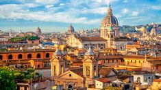 an aerial view of the city of rome, italy with its cathedrals and rooftops