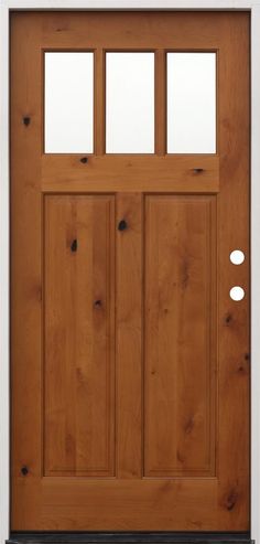 a wooden door with three glass panels