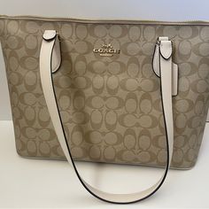 It’s Brand New With Tags Never Been Used Luxury Cream Bag With Zipper Closure, Designer Beige Bags With Zipper Closure, Coach Beige Shoulder Bag With Large Capacity, Coach Beige Shoulder Bag Large Capacity, Coach Beige Large Capacity Shoulder Bag, Large Capacity Coach Beige Bag, Coach Beige Shoulder Bag With Zipper Closure, Beige Coach Shoulder Bag With Zipper Closure, Elegant Coach Bags With Large Capacity