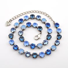 Bluebell The Bluebell pattern's stunning collection of blue, sapphire and air blue opal crystals is sure to add a touch of sparkle to your day. Whether it's a spring wedding or a special birthday, these exquisite crystals are sure to make your outfit shine. Product Details: Crystal Size: 8.5mm Crystal Color: Denim Blue, Light Sapphire Matte, Sapphire, Air Blue Opal, Light Sapphire Setting Options: Shiny Silver, Antique Silver, Gold, Rose Gold, Antique Brass, Antique Copper, Rhodium Necklace Length: Adjustable from 14 to 17 inches. Bracelet Length: Adjustable from 6 to 8 inches.  Handmade in the USA with nickel free settings and the highest quality European crystal elements. 8.5mm Crystal Jewelry handmade with the highest quality European crystal elements. Pieces are shown in a Shiny Silver Crystal Jewelry Necklaces, Handmade Crystal Jewelry, Light Sapphire, Brass Antique, Opal Crystal, Adjustable Necklace, Special Birthday, Shiny Silver, Austrian Crystal