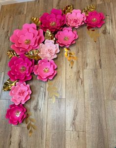 pink and gold paper flowers on the floor