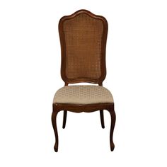 a brown chair with a beige seat cushion on it's back and side, in front of a white background