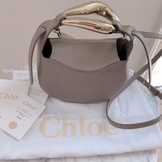 New With Dust Bag And Authenticity Card . 100% Authentic Guaranteed . By Chloe . Super Unique Bag With Removal Straps And Roomy Interior . 100% Leather . Please Note Small Scuff Marks On Metal Handle . No Trades!! Tags: Luxury , Designer , Modern , Contemporary , Boho , Bohemian , Minimalist Chloe Saddle Bag, Chloe Kiss Bag, Chloe Sense Bag, Chloe Mini Bag, Chloe Faye Day Bag, Chloe Mini C Bag, Chloe Faye Day Bag Medium, Chloe Marcie Bag, Chloe Faye Bag