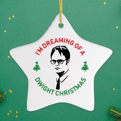 a white ceramic star ornament with the words i'm dreaming of a dwight christmas