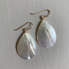 "Join my mailing list: http://eepurl.com/ci4wL and receive 10% off your next order! Follow me on Instagram: Instagram: http://instagram.com/ruthiebeeeeee Overview * Abalone teardrop earrings * White mother of pearl drop dangle earrings * Handmade with sterling silver or gold earwires * Summer Accessory * Great Mother's Day gift for mom * Classic, Simple, Elegant * Shown with 2mm cubic zirconia studs, available here: https://www.etsy.com/listing/220963745/clear-stud-earrings-2mm-cubic-zirconia?re Everyday Handmade Teardrop Pearl Earrings, Pearl White Teardrop Earrings For Everyday, Everyday Pearl White Teardrop Earrings, Teardrop Mother Of Pearl Earrings With Ear Wire, Handmade Teardrop Pearl White Earrings, Pearl Drop Mother Of Pearl Dangle Earrings, Pearl Drop Mother Of Pearl Earrings, Pearl Teardrop Earrings, Large Dangle Earrings