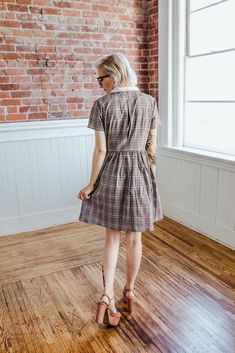 Pockets, collars and plaid...This is what we like to refer to the trifecta of all things we love! The ACADEMY dress is a classic little shirtdress with short sleeves featuring a functioning button down front bodice with a very full pleated skirt. Designed for wearing ease and comfort, the ACADEMY is patterned for a relaxed fit waistline and a back bodice pleat to allow increased mobility across the the back and shoulders. And the best part? The collar is detachable, wear this dress 2 ways! + D E Los Angeles Shopping, Sunday Dress, Knee Skirts, Cotton Shirt Dress, Contrast Collar, Gray Plaid, House Dress, Gathered Skirt, Sewing A Button