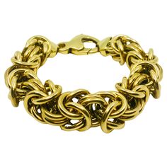 CIRCA: 1990’s MATERIALS: 18k Yellow Gold WEIGHT: 114 grams MEASUREMENTS: 8 1/2” x 3/4” HALLMARKS: 18K, Italy ITEM DETAILS: A gorgeous Byzantine bracelet, made of 18k gold in Italy. It’s a chunky yet airy piece with a substantial clasp. The clasp works as a decorative element itself or can carry a charm. The links are high-polished gold, and it turns the intricate pattern into a luxurious piece. Formal Byzantine Yellow Gold Bracelets, Formal Yellow Gold Byzantine Bracelet, Yellow Gold Byzantine Bracelet For Formal Occasions, Formal Gold Byzantine Bracelets, Formal Byzantine Yellow Gold Bracelet, 18k Gold Bracelet, Hallmark, Link Bracelets, Gold Bracelet