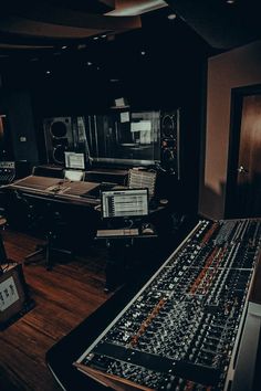 an empty recording studio with sound equipment