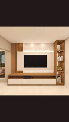 an empty living room with a television on the wall and shelves in front of it