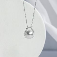 South Sea saltwater cultured pearl 18K solid gold, and diamonds Size: 1 pearl 10-11 mm, 1pc Weight of diamonds: 28 diamonds, around 0.142 carats in total Chain length: 42+3 cm (adjustable) Pendant parameters: 1.3*1.5 cm Handpicked of every pearl, only the top 1% of pearls are selected Handcrafted Lifetime warranty Discount codes are not available for this product. Haute Jewelry, Modern Necklace, Sea Pearl, Modern Necklaces, South Seas, South Sea Pearls, Diamond Sizes, Discount Codes, Chain Length