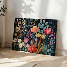 an image of a painting on the wall with flowers painted on it and plants in the background