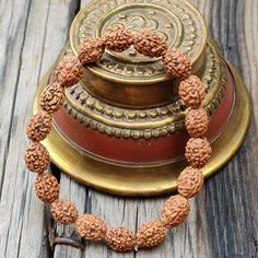 📿Our Four Mukhi Bracelet is handcrafted with Natural 4 Mukhi (Four-Faced) Rudraksha Beads. This Bracelet is essentially for those who seek knowledge, comprehending the essence behind the creation and become more creative. Like the four-faced Lord Brahma, the wearer gains knowledge from all the four cardinal directions. It is suitable for all 4 stages of human life. They are Brahmacharya, Grihastha, Vanaprastha and Sanyasa. The new age contemporary lifestyles require continuous assimilation of k Adjustable Bohemian Bracelets For Puja, Spiritual Round Bracelets For Festivals, Adjustable Bracelets For Puja, Adjustable Round Bracelets For Puja, Hand-strung Bracelets For Rituals And Festivals, Traditional 108 Beads Bracelet For Festivals, Traditional Bracelets With 108 Beads For Festivals, Hand-strung Bracelets For Puja And Festivals, Traditional Hand-wrapped Bracelets For Meditation