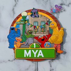 the sesame street 1 mya sign is decorated with characters from sesame street and elm street