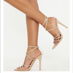 Nude Strappy Sandal Pointed Toe Beige Strappy Heels With Wrapped Heel, Beige Strappy Heels With Heel Strap, Fitted Beige Sandals With Wrapped Heel, Cream Strappy Heels For Party, Chic Cream Strappy Sandals, Strappy Cream Heels With Heel Strap, Cream Strappy Heels With Wrapped Heel, Cream Strappy Heels With Heel Strap, Trendy Beige Strappy Sandals