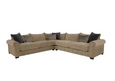 a large sectional couch with pillows on the top and bottom corner, in beige fabric