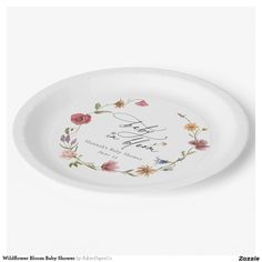 a white paper plate with flowers and the words love you written on it in cursive writing