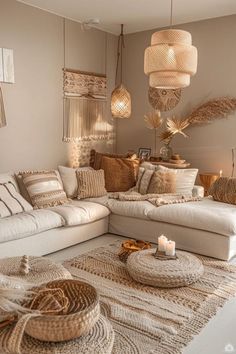 a living room filled with white furniture and lots of pillows on top of a rug