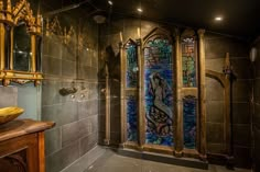 a fancy bathroom with stained glass windows in the shower