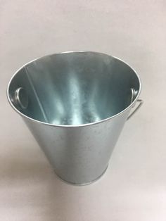 an empty metal bucket on a white background