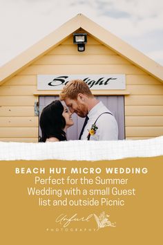 a man and woman standing in front of a yellow building with the words beach hut micro wedding