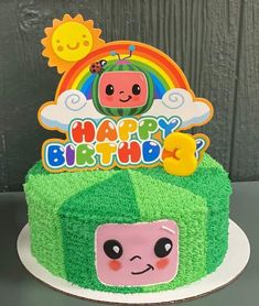 a birthday cake with an image of a cartoon character on it