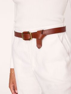 Slide thru, rectangular buckle New fastening detail Length: XS/S 41", M/L 44" 100% genuine leather Shipped with a BW bag for easy storing Made in USA Our Saddle Belt in 100% genuine leather has a modern, yet relaxed sensibility. An 'easy-to-slide-thru' sculptural buckle with a new fastening detail adds that feminine touch you expect from Brochu Walker. We love styling it with our dresses or with a favorite pair of jeans and our beautiful knitwear. Exclusive To BrochuWalker.com and our Brochu Wal Leather Belts With Buckle Closure For Office, Leather Belt With Buckle Closure For Office, Timeless Leather Belt For Office, Timeless Leather Belts For Office, Leather Belt With Buckle Closure For Fall, Classic Leather Belt For Fall, Classic Leather Belts For Fall, Chic Brown Belt With Buckle Closure, Modern Leather Belts With Buckle Closure