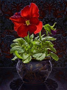 a painting of two red flowers in a vase