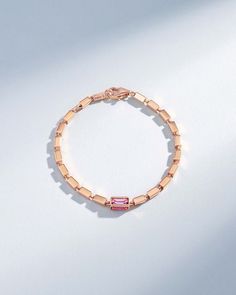 Crafted with solid 18-karat gold, this block-chain bracelet presents a symphony of four-sided links. It features four pink sapphire baguettes set in one link encased by a golden frame. The thick, block-chains add a contemporary edge to the timeless design making it perfect for casual or evening wear. Details 18k rose gold or yellow gold 1.40 carats of pink sapphire baguettes 7" inch bracelet is adjustable at 6.5" inches 8" inch bracelet is adjustable at 7.5" inches Model is styling 7" bracelet i Formal Rose Gold Baguette Jewelry, Rose Gold Rectangular Jewelry With Bracelet Strap, Rose Gold Rectangular Bracelet Jewelry, Luxury Rose Gold Bracelet With Rectangular Links, Pink 14k Gold Baguette Cut Jewelry, Elegant Pink Jewelry With Baguette Diamonds, Elegant Pink Baguette Diamond Jewelry, Pink Bracelet Strap Jewelry For Formal Occasions, Pink Bracelet Style Jewelry For Formal Occasions