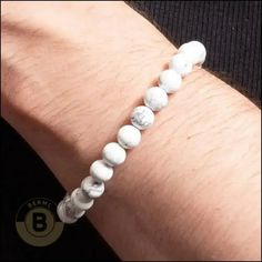 The Kincaid is a sleek statement piece that cuts through the noise. This cool, sharp white howlite isn’t flashy, but it packs a punch. It's like strapping on a shot of confidence, ready to tackle whatever life throws your way. Gear up and conquer! Specifications: Material: RockFinish: Polished Why do men's beaded bracelets never go out of style? Because they're the quintessential blend of fashion and ease. These bracelets are not just an accessory; they're an attitude. Our collection of gemstone- and bead bracelets for men takes this vibe to the next level. From casual cool to formal finesse, these bracelets are your go-to for an instant style upgrade. Modern White Bracelets With Round Beads, Modern White Round Beads Bracelets, Modern White Round Bead Bracelets, Modern White Round Beaded Bracelets, White Modern Beaded Bracelets, Modern White Beaded Bracelets, Modern White Beaded Bracelet, Minimalist White Beaded Bracelets For Everyday, Casual White Jewelry With 8mm Beads