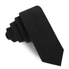 The Dean Martin Black Linen Skinny Tie is an essential staple for formal stylings. The Brothers at OTAA have reprised the classic Black Slim tie, lending a textured dash of stellar charm to the smart trim of the body of the Skinny Tie, meaning you can rappel into your next board meeting with style!

The coarse linen enriches the visual scope of the Skinny Tie with varying thickness to the plush hand-woven noir black coloured thread. The airy linen fabric is somewhat coarse, with an added texture Black-tie Single Button Suit, Semi-formal Navy Standard Tie, Luxury Black Semi-formal Ties, Mr Martin, Slim Tie, Board Meeting, Flower Lapel Pin, Dean Martin, Black Rib