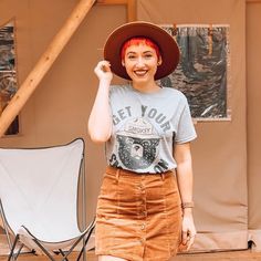 Graphic tshirts are amazing outfit staples, and this graphic tee and corduroy skirt outfit with a flat brim hat is such a fun glamping outfit for summer and fall! It's total cozy, cute vibes and the perfect skirt and tshirt outfit idea! Red Pixie Cut, Glamping Outfit, Cute Camping Outfits, Corduroy Skirt Outfit, Graphic Tee Outfit, Waterproof Clothing