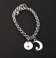 Personalized Antique Silver Moon Bracelet!  A detailed crescent moon and star charm on a lovely chain bracelet makes the perfect gift for you or your best friend.The moon bracelet charm is made from zinc alloy and measures 10 x 14 mm.  The bracelet is high quality zinc alloy and measures 8.5".  The moon charm bracelet can be personalized with a .5" silver plated disc stamped with the initial of your choice.  The charm and initial disc are connected to the bracelet with sturdy split rings that wi Silver Beaded Bracelets With Moon Charm As Gift, Adjustable Moon Charm Bracelet, Celestial Bracelet, Bible Verse Bracelet, Best Friend Bracelet, Crescent Moon And Star, Friend Bracelet, Best Friend Bracelets, French Hook Earrings