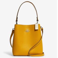 Our Polished Pebble Leather Small Town Bucket Bag Is An Essential Style With A Long Detachable Crossbody Strap And A Top Handle For Versatile Wear. Double Face Leather Center Zip Compartment Snap Closure Handle With 6 3/4" Drop Detachable Strap With 22" Drop For Shoulder Or Crossbody Wear 8 1/2" (L) X 8 3/4" (H) X 4" (W) 100% Authentic, Nwt Color: Ochre/Wine Please See Pictures For Reference Coach Saddle Bag, Coach Rogue, Coach Crossbody Purse, Bags Coach, Coach Outlet, Coach Gifts, Gold Orange, Crossbody Messenger Bag, Online Bags