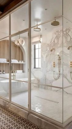 a large bathroom with marble walls and floors