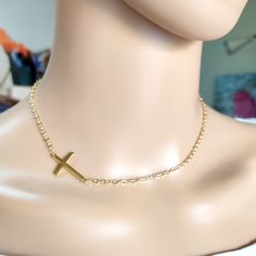 Cross gold steel necklace, Layering jewelry, Religion cross choker, Gold necklace, Minimalist jewelry, Dainty cross choker, Tiny necklace Beautiful simple necklace with gold stainless steel cross and steel chain. Simple choker or everyday wear Length 42cm  The necklace will be delivered inside a craft jewelry box. JEWELRY CARE: Please take care of your jewelry do not wear in the shower, swimming pool, or to bed. Keep away from harsh chemicals and cleaners. It is always best to put on your jewelry on after applying lotions, hair sprays and make-up. Remember to always remove your jewelry before doing any activity that could cause damage to your jewelry. more necklaces https://www.etsy.com/shop/artncreate?ref=seller-platform-mcnav§ion_id=14284001 Thanks for visiting! Minimalist Chain Necklace With Cross Pendant As Gift, Minimalist Cross Pendant Chain Necklace As Gift, Minimalist Cross Chain Necklace With Delicate Chain, Minimalist Gold Chain Necklace With Cross Pendant, Minimalist Delicate Chain Cross Necklace, Minimalist Clavicle Cross Chain Jewelry, Gold Adjustable Minimalist Cross Necklace, Delicate Chain Cross Necklace For Gift, Delicate Cross Chain Necklace Gift