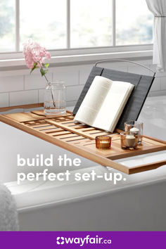 a bathtub with an open book on it