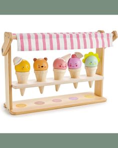 an ice cream stand with five different kinds of ice creams on it and two bears in the middle