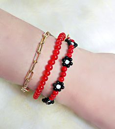 Hello guys!  BTS V Kim Taehyung Inspired Bracelets. Beautifully handcrafted just for you guys. If love the style of his bracelets you can purchase the whole set or separately.  Materials: 1. Beaded Red and Black Flower Bracelet: Red tiger eye- Beads Size: 3mm, 2mm, 4mm. Closure: Lobster Claw, Chain Extender 18k real Gold filled.  2. Chain link Bracelet - 3*9mm. Bracelet length: 5 inches, 6 inches, 7 inches Material: 18K Pure gold filled. High Quality, Non tarnish, Allergy free. 3. Chain Bracelet Casual Red Bracelets For Party, Trendy Red Bracelets For Party, Trendy Red Beaded Bracelets With Colorful Beads, Red Beaded Bracelets With Beaded Chain, Trendy Red Beaded Bracelet With Letter Beads, Trendy Red Beaded Bracelets As Gift, Trendy Red Handmade Beaded Bracelets, Trendy Red Bracelets With Colorful Beads, Trendy Red Beaded Chain Jewelry