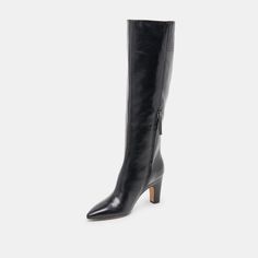 Every wardrobe needs a dressier knee-high boot. NELAS fits the bill with an understated design in sophisticated leather. Style her with short dresses or under wide leg jeans. Leather Upper Rubber Outsole Synthetic Lining + Sock 15.4" Shaft Height 14.5" Leg Circumference 3.2" Heel Height Imported Elegant Tall Boots For Workwear, Tall Evening Boots For Fall, Elegant Tall Boots For Work, Knee-high Boots For Evening In Fall, Tall Knee-high Boots For Evening In Fall, Elegant Tall Mid-calf Boots For Fall, Black Mid-calf Boots High Shaft For Work, Black Mid-calf Boots For Work With High Shaft, Elegant Tall Heeled Boots With Stacked Heel