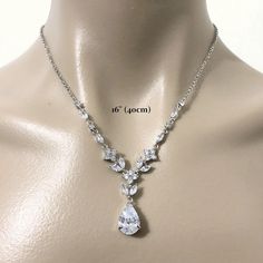 "A classic woodland wedding nature inspired teardrop bridal necklace featuring vines, leaves and flower petal pendant, made of sparkly clear cubic zirconia. This beautiful cz jewelry comes in tarnish-resistant silver rhodium plated chain. Necklace length is adjustable from 17\" (43cm) to 19\" (48cm) . View matching pieces or similar designs at https://etsy.me/2JAovjr View designs related to vines, branches, twigs or leaves at https://etsy.me/1E5j438 View designs with marquise shapes at https://e Elegant Teardrop Bridal Necklace For Anniversary, Sparkling Drop Bridal Necklace, Elegant Teardrop Pendant Wedding Necklace, Wedding Cubic Zirconia Dangle Drop Necklace, Silver Teardrop Hand Set Bridal Necklace, Teardrop Cubic Zirconia Bridal Necklace For Anniversary, Cubic Zirconia Dangle Drop Necklace For Wedding, Elegant Teardrop Pendant Drop Necklace For Wedding, Teardrop Bridal Necklace In Cubic Zirconia