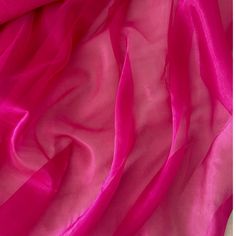 Fuchsia Crystal Organza Fabric by the yard, bulk or wholesale.  Delicately sheer, lightweight, and incredibly soft to the touch, it's the ideal choice for a wide range of projects. Our Hot Pink Organza fabric is perfect for creating exquisite garments and decorations.  Crafted from 100% polyester, this lightweight fabric offers a sheer and crisp drape, providing strength and elegance in every project. Whether you're designing ball gowns, wedding dresses, blouses, scarves, bridal apparel or fabric roses, organza is the ideal choice for achieving voluminous and structural effects. This Fuchsia Organza organza fabric is also perfect for event decorations. Whether it's baby shower decor or wedding decorations, the sheer beauty of this organza fabric adds a captivating touch to any setting.  Pr Bridal Apparel, Green Tulle, Event Decorations, Pink Sheer, Fabric Roses, Gowns Wedding, Organza Fabric, Holiday Colors, Shower Decor