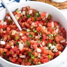 a white bowl filled with chopped tomatoes and onions